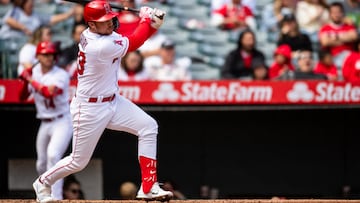 Oct 1, 2023; Anaheim, California, USA; Los Angeles Angels first baseman Brandon Drury (23) doubles against the Oakland Athletics during the fourth inning at Angel Stadium. Mandatory Credit: Jonathan Hui-USA TODAY Sports