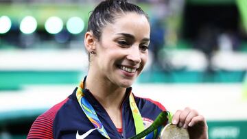 RIO DE JANEIRO, BRAZIL - AUGUST 11:  Silver medalist Alexandra Raisman of the United States poses for photographs after the medal ceremony for the Women&#039;s Individual All Around on Day 6 of the 2016 Rio Olympics at Rio Olympic Arena on August 11, 2016 in Rio de Janeiro, Brazil.  (Photo by Elsa/Getty Images)