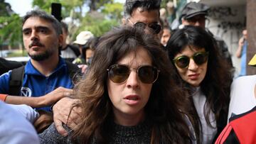 Dalma (C) and Giannina Maradona (R), daughters of late Argentine football legend Diego Maradona, arrive at the San Isidro court ahead of the trial for the death of their father in Buenos Aires on March 11, 2025. Four years after Diego Maradona's death, the trial of seven health professionals begins this Tuesday in Argentina to determine their responsibilities in the death of the soccer legend. (Photo by Luis ROBAYO / AFP)
