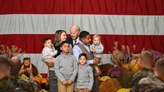 US President Joe Biden greets a military family while arriving to a "Friendsgiving" celebration in honor of the upcoming Thanksgiving holiday, at the Marine Corps Air Station in Cherry Point, North Carolina, on November 21, 2022. (Photo by Jim WATSON / AFP) (Photo by JIM WATSON/AFP via Getty Images)