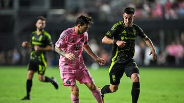 Inter Miami's Argentine forward #10 Lionel Messi (C) fights for the ball with Columbus Crew's French midfielder #07 Dylan Chambost (R) during the Major League Soccer match between Inter Miami CF and Columbus Crew at Chase Stadium in Fort Lauderdale, Florida, on May 31, 2025. (Photo by CHANDAN KHANNA / AFP)