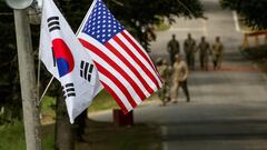 FILE PHOTO: The South Korean and American flags fly next to each other at Yongin, South Korea, August 23, 2016. Picture taken on August 23, 2016.  Courtesy Ken Scar/U.S. Army/Handout via REUTERS/File Photo