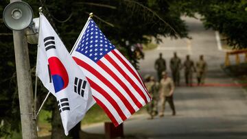 FILE PHOTO: The South Korean and American flags fly next to each other at Yongin, South Korea, August 23, 2016. Picture taken on August 23, 2016.  Courtesy Ken Scar/U.S. Army/Handout via REUTERS/File Photo