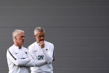 (FILES) In this file photo taken on July 7, 2018, France's head coach Didier Deschamps (L) speaks with France's doctor Franck Le Gall (R) during a training session at the Glebovets stadium in Istra