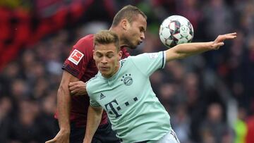 Bayern Munich&#039;s midfielder Joshua Kimmich (R) and Nuremberg&#039;s Brazilian defender Ewerton vie for the ball during the German first division Bundesliga football match Nuremberg v FC Bayern Munich on April 28, 2019 in Nuremberg, southern Germany. (