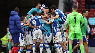 Real Sociedad players celebrate their qualification for the UEFA Champuons League at the end of the Spanish league football match between Club Atletico de Madrid and Real Sociedad at the Wanda Metropolitano stadium in Madrid on May 28, 2023. (Photo by Pierre-Philippe MARCOU / AFP)