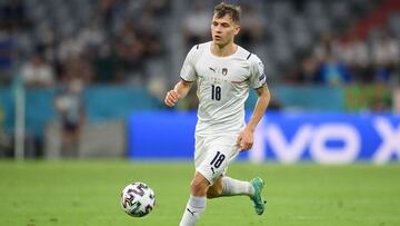 Italy's midfielder Nicolo Barella runs with the ball during the UEFA EURO 2020 quarter-final football match between Belgium and Italy at the Allianz Arena in Munich on July 2, 2021. (Photo by Matthias Hangst / POOL / AFP)