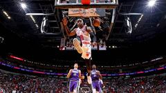 Victor Oladipo #4 of the Miami Heat dunks the ball against the Milwaukee Bucks on January 14, 2023 at Miami-Dade Arena in Miami, Florida.