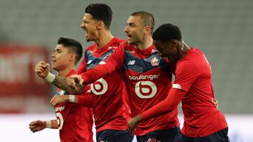 Soccer Football - Ligue 1 - Lille v OGC Nice - Stade Pierre-Mauroy, Lille, France - May 1, 2021 Lille's Burak Yilmaz celebrates scoring their first goal with teammates REUTERS/Pascal Rossignol