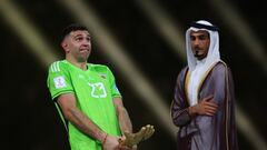 Soccer Football - FIFA World Cup Qatar 2022 - Final - Argentina v France - Lusail Stadium, Lusail, Qatar - December 18, 2022 Argentina's Emiliano Martinez reacts after receiving the Golden Glove award after the match REUTERS/Kai Pfaffenbach     TPX IMAGES OF THE DAY