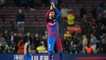 Barcelona's Spanish defender Gerard Pique celebrates at the end of the Spanish league football match between FC Barcelona and Valencia CF at the Camp Nou stadium in Barcelona on October 17, 2021. (Photo by LLUIS GENE / AFP)