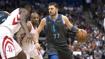 Mar 10, 2019; Dallas, TX, USA; Dallas Mavericks forward Luka Doncic (77) controls the ball against the Houston Rockets during the second quarter at the American Airlines Center. Mandatory Credit: Jerome Miron-USA TODAY Sports