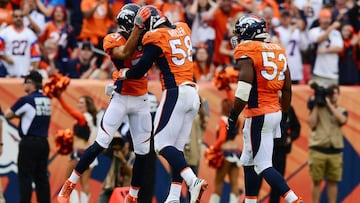 DENVER, CO - OCTOBER 30: Free safety Justin Simmons #31 and outside linebacker Von Miller #58 of the Denver Broncos celebrate a sack on third down in the fourth quarter of the game against the San Diego Chargers at Sports Authority Field at Mile High on October 30, 2016 in Denver, Colorado.   Dustin Bradford/Getty Images/AFP
 == FOR NEWSPAPERS, INTERNET, TELCOS &amp; TELEVISION USE ONLY ==