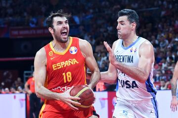 Pierre Oriola and Luis Scola in action.