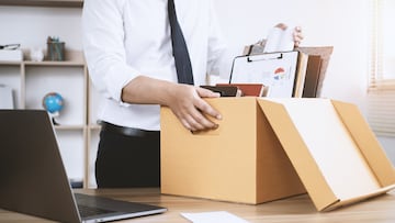 Resignation Businessmen are gradually packing personal boxes and resignation letters. Concept of unemployment, resignation, big resignation