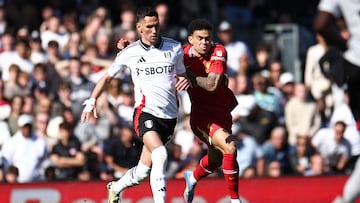 Fulham's Serbian midfielder #20 Sasa Lukic (L) vies with Liverpool's Colombian midfielder #07 Luis Diaz (R) during the English Premier League football match between Fulham and Liverpool at Craven Cottage in London on April 6, 2025. (Photo by HENRY NICHOLLS / AFP) / RESTRICTED TO EDITORIAL USE. No use with unauthorized audio, video, data, fixture lists, club/league logos or 'live' services. Online in-match use limited to 120 images. An additional 40 images may be used in extra time. No video emulation. Social media in-match use limited to 120 images. An additional 40 images may be used in extra time. No use in betting publications, games or single club/league/player publications. /