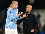 Pep Guardiola, junto a Haaland.