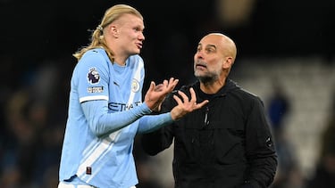 Pep Guardiola, junto a Haaland.