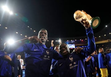 France's N'Golo Kante and Paul Pogba celebrate with the World Cup.