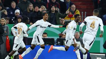 Soccer Football - DFB Cup - Round of 16 - Bayern Munich v Bayer Leverkusen - Allianz Arena, Munich, Germany - December 3, 2024 Bayer Leverkusen's Nathan Tella celebrates scoring their first goal with teammates REUTERS/Kai Pfaffenbach DFB REGULATIONS PROHIBIT ANY USE OF PHOTOGRAPHS AS IMAGE SEQUENCES AND/OR QUASI-VIDEO.