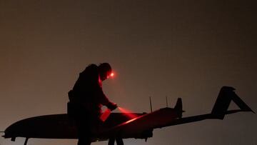 A Ukrainian service member of the 14th Unmanned Aerial Systems Regiment prepares a deep strike unmanned aerial vehicle before its launch toward Russian territory, amid Russia's attack on Ukraine, in an undisclosed location in Ukraine, undisclosed date, 2025. REUTERS/Valentyn Ogirenko