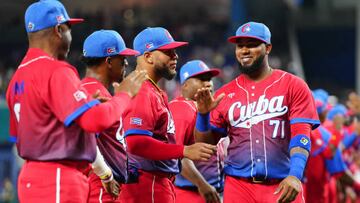 MIAMI, FL - MARCH 19:   Erisbel Arruebarrena #71 of Team Cuba high-fives teammates on the field prior to the 2023 World Baseball Classic Semifinal game between Team Cuba and Team USA at loanDepot Park on Sunday, March 19, 2023 in Miami, Florida. (Photo by Mary DeCicco/WBCI/MLB Photos via Getty Images)