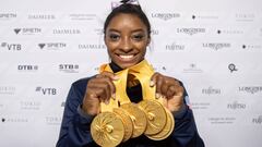 USA&#039;s Simone Biles poses after the apparatus finals with the five gold medals she won at the FIG Artistic Gymnastics World Championships at the Hanns-Martin-Schleyer-Halle in Stuttgart, southern Germany, on October 13, 2019. (Photo by Marijan Murat /