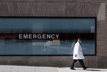 A doctor walks past the emergency room at the Mount Sinai Hospital in New York.