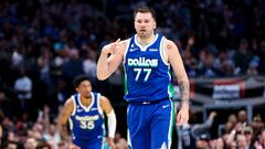 Dallas Mavericks guard Luka Doncic (77) reacts after scoring during the third quarter against the Charlotte Hornets at American Airlines Center.