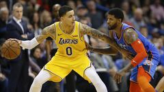 Jan 17, 2019; Oklahoma City, OK, USA; Los Angeles Lakers forward Kyle Kuzma (0) drives to the basket against Oklahoma City Thunder forward Paul George (13) during the second half at Chesapeake Energy Arena. Los Angeles won 138-128. Mandatory Credit: Alonzo Adams-USA TODAY Sports