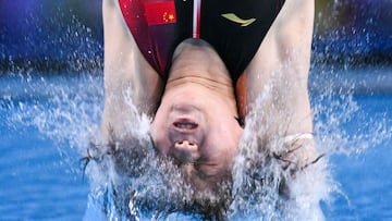 Olympic divers often enter a hot tub right after their dive, but why do they do this?