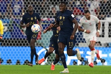 France's midfielder #13 Youssouf Fofana runs with the ball during the Qatar 2022 World Cup Group D football match between Tunisia and France at the Education City Stadium in Al-Rayyan, west of Doha on November 30, 2022. (Photo by Miguel MEDINA / AFP) (Photo by MIGUEL MEDINA/AFP via Getty Images)