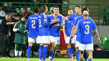 Italy's defender #23 Gianluca Mancini (C) celebrates with teammates after scoring his team's first goal during the 2026 World Cup qualifiers Europe zone group I football match between Moldova and Italy at the Zimbru Stadium in Chisinau, on November 13, 2025. (Photo by Daniel MIHAILESCU / AFP)