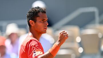 Peru's Juan Pablo Varillas celebrates a point against Serbia's Novak Djokovic during their men's singles match on day eight of the Roland-Garros Open tennis tournament at the Court Philippe-Chatrier in Paris on June 4, 2023. (Photo by Emmanuel DUNAND / AFP)