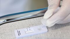 Civil protection agent Mehdi Ben Khaelifa performs an antigenic rapid test at the screening center of La Tour Hospital as Swiss civil protection agents are deployed to help during the coronavirus disease (COVID-19) outbreak in Meyrin near Geneva, Switzerl