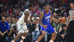 Mar 12, 2024; Los Angeles, California, USA; Los Angeles Clippers forward Kawhi Leonard (2) moves the ball against Minnesota Timberwolves guard Anthony Edwards (5)  during the first half at Crypto.com Arena. Mandatory Credit: Gary A. Vasquez-USA TODAY Sports