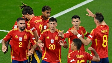 (From L) Spain's defender #02 Dani Carvajal, Spain's forward #19 Lamine Yamal, Spain's midfielder #20 Pedri, Spain's forward #07 Alvaro Morata, Spain's midfielder #16 Rodri and Spain's midfielder #08 Fabian Ruiz celebrate after an own goal giving Spain the lead during the UEFA Euro 2024 Group B football match between Spain and Italy at the Arena AufSchalke in Gelsenkirchen on June 20, 2024. (Photo by INA FASSBENDER / AFP)