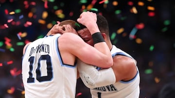 SAN ANTONIO, TX - APRIL 02: Donte DiVincenzo #10 and Jalen Brunson #1 of the Villanova Wildcats celebrate after defeating the Michigan Wolverines during the 2018 NCAA Men&#039;s Final Four National Championship game at the Alamodome on April 2, 2018 in San Antonio, Texas. Villanova defeated Michigan 79-62.   Tom Pennington/Getty Images/AFP
 == FOR NEWSPAPERS, INTERNET, TELCOS &amp; TELEVISION USE ONLY ==