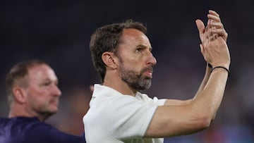 England's head coach Gareth Southgate gestures to fans after the UEFA Euro 2024 Group C football match between England and Slovenia at the Cologne Stadium in Cologne on June 25, 2024. (Photo by Adrian DENNIS / AFP)
