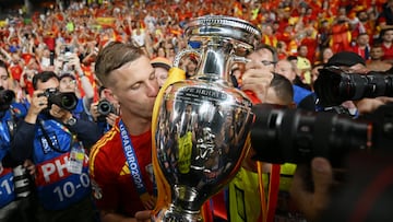 BERLIN, GERMANY - JULY 14: Dani Olmo of Spain kisses the UEFA Euro 2024 Henri Delaunay Trophy after his team's victory in the UEFA EURO 2024 final match between Spain and England at Olympiastadion on July 14, 2024 in Berlin, Germany. (Photo by Dan Mullan/Getty Images)