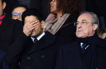 Paris Saint-Germain's Qatari president Nasser Al-Khelaifi grimaces next to Real Madrid's Spanish president Florentino Perez.