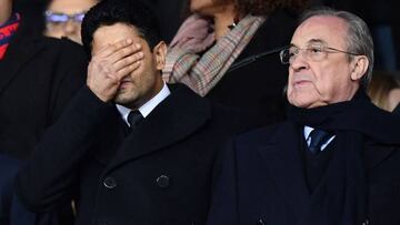 Paris Saint-Germain's Qatari president Nasser Al-Khelaifi grimaces next to Real Madrid's Spanish president Florentino Perez.