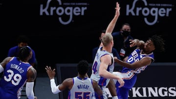 Jan 25, 2021; Detroit, Michigan, USA; Philadelphia 76ers guard Tyrese Maxey (0) passes on Detroit Pistons center Mason Plumlee (24) in the first half at Little Caesars Arena. Mandatory Credit: Rick Osentoski-USA TODAY Sports