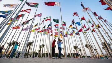 People gather at the Flag plaza in Doha on November 15, 2022, ahead of the Qatar 2022 World Cup football tournament. (Photo by ANDREJ ISAKOVIC / AFP)