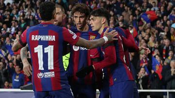 Barcelona's Portuguese forward #14 Joao Felix celebrates with teammates after scoring his team's second goal during the UEFA Champions League first round group H football match between FC Barcelona and FC Porto at the Estadi Olimpic Lluis Companys in Barcelona on November 28, 2023. (Photo by LLUIS GENE / AFP)