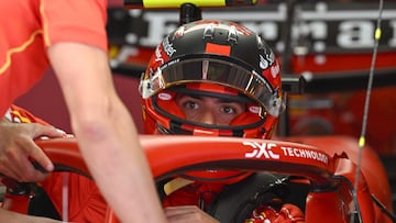 Ferrari's Spanish driver Carlos Sainz Jr gets ready in his car ahead of the first practice session for the Formula One Chinese Grand Prix at the Shanghai International Circuit in Shanghai on April 19, 2024. (Photo by HECTOR RETAMAL / AFP)