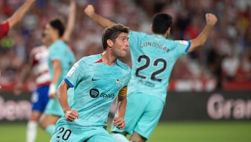 Barcelona's Spanish midfielder #20 Sergi Roberto celebrates after scoring his team's second goal during the Spanish league football match between Granada FC and FC Barcelona at the Nuevo Estadio de Los Carmenes in Granada on October 8, 2023. (Photo by JORGE GUERRERO / AFP)