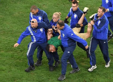Pitch invader at Portugal match tries to hug Cristiano Ronaldo
