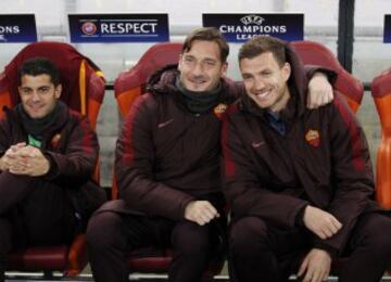 Roma legend Totti on the bench.