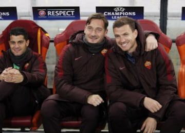 Roma legend Totti on the bench.